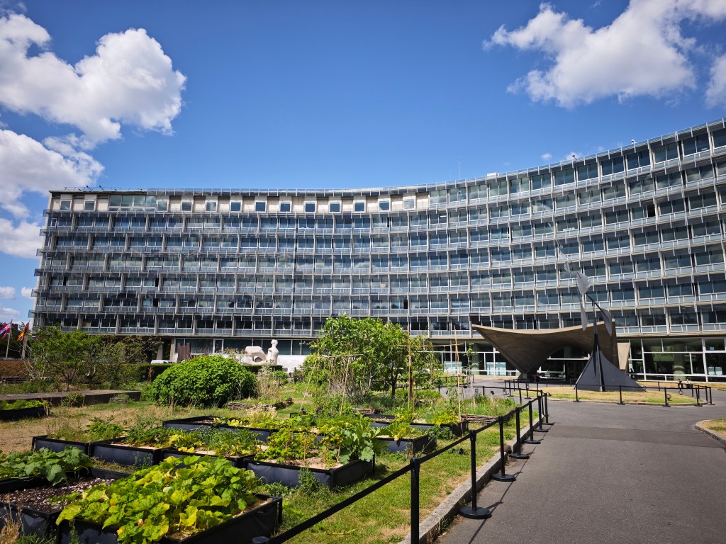 UNESCO headquarters in Paris with a garden in the foreground.