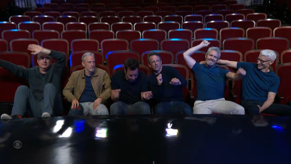 Stephen Colbert with other late-night hosts in a theater audience.