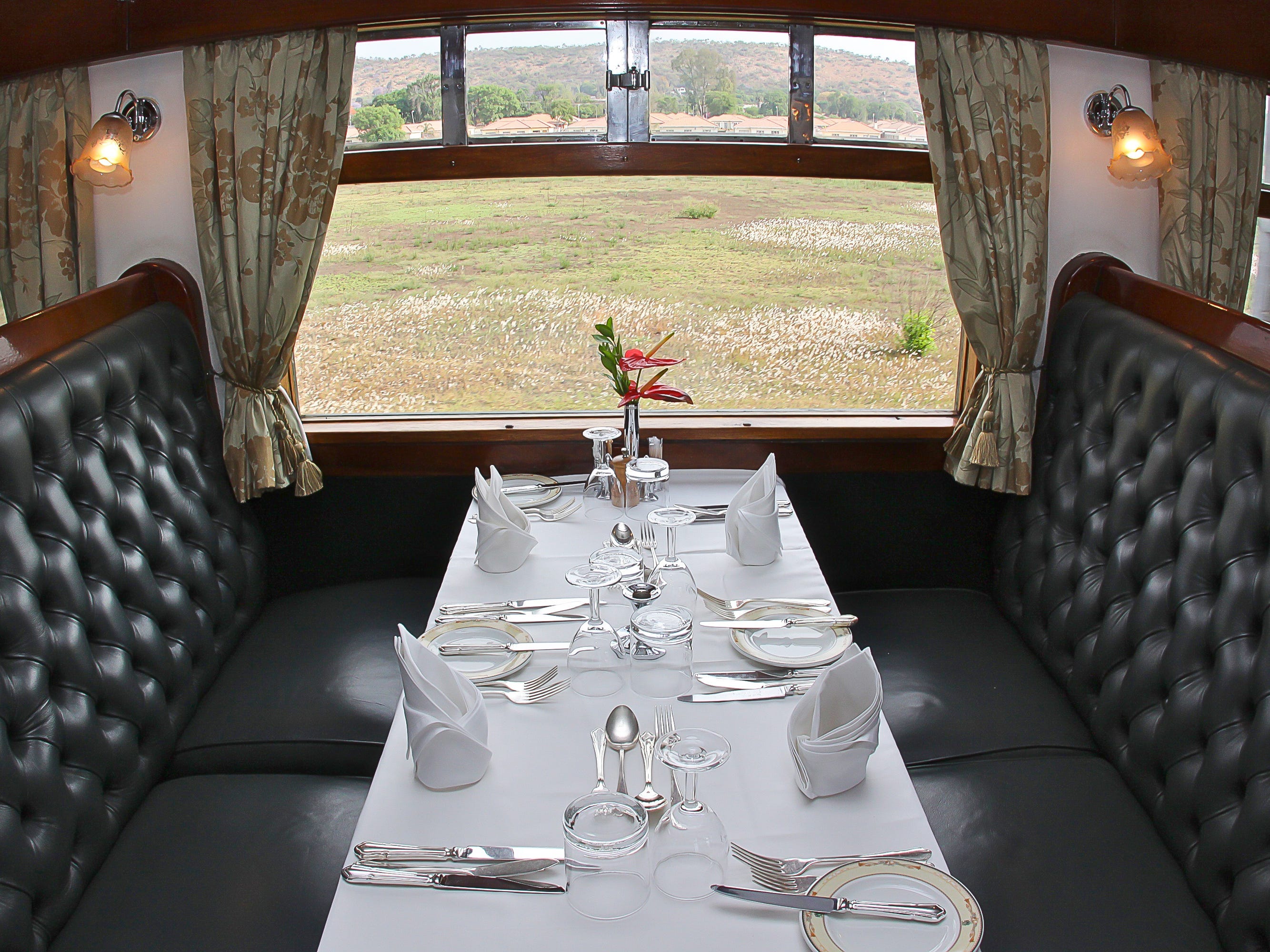 A set table in a train dining cart.