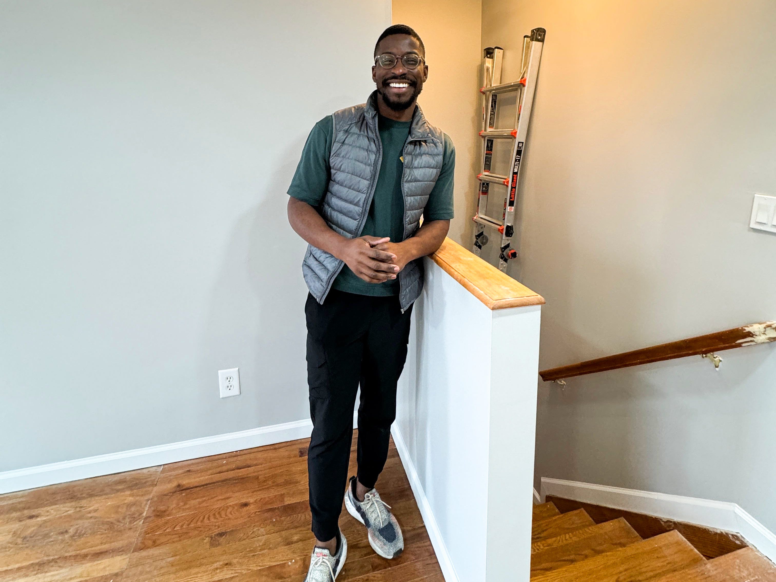 Isreal Adeyanju standing next to a stairwell.