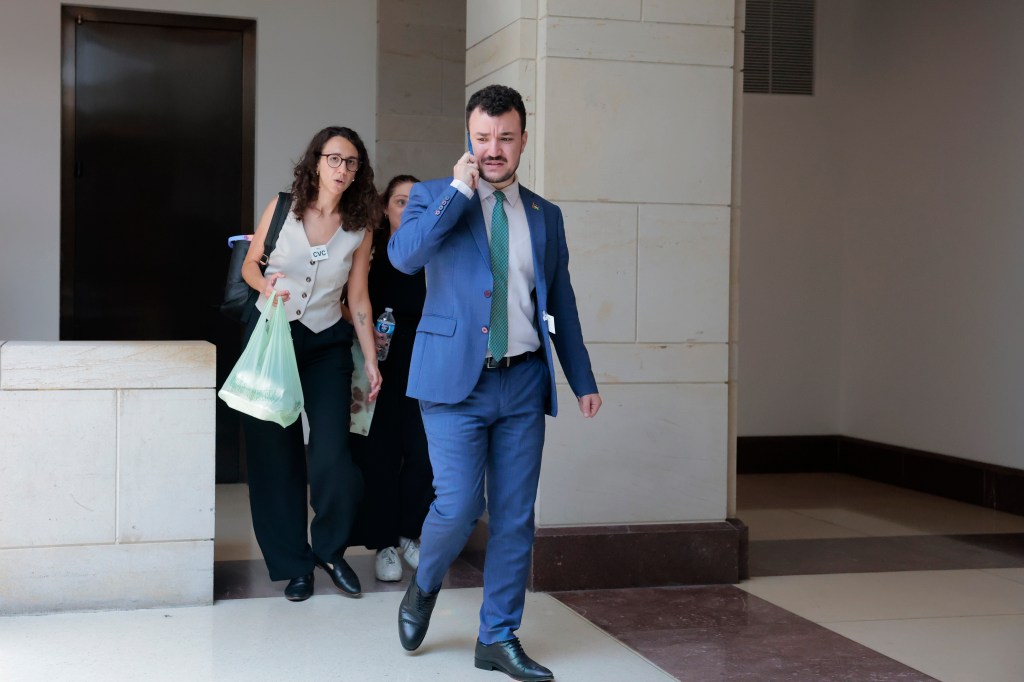 Mahmoud Khalil, a former Columbia University graduate student, on his phone walking in the U.S. Capitol Visitor Center.