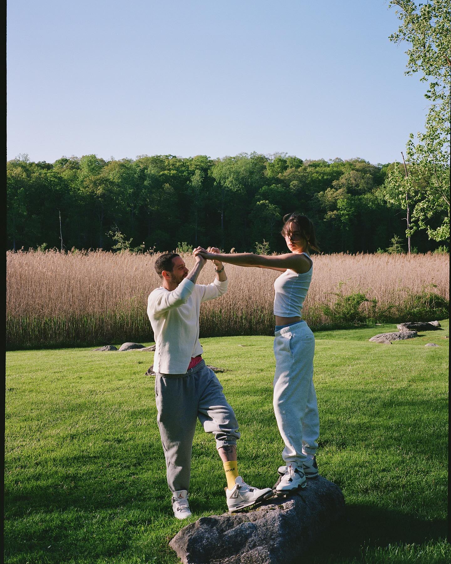 Pete Davidson and Elsie Hewitt outdoors. 