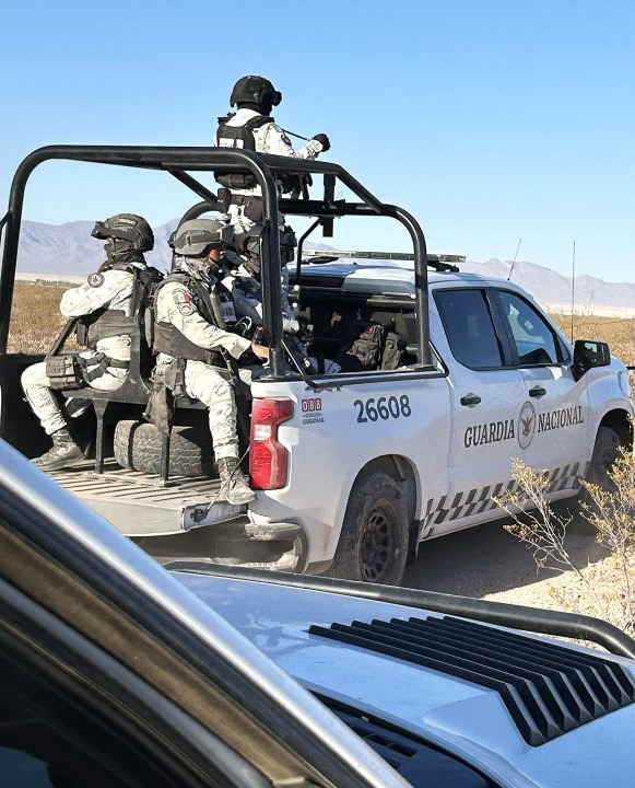 Mexican National Guard officers in the back of a truck.
