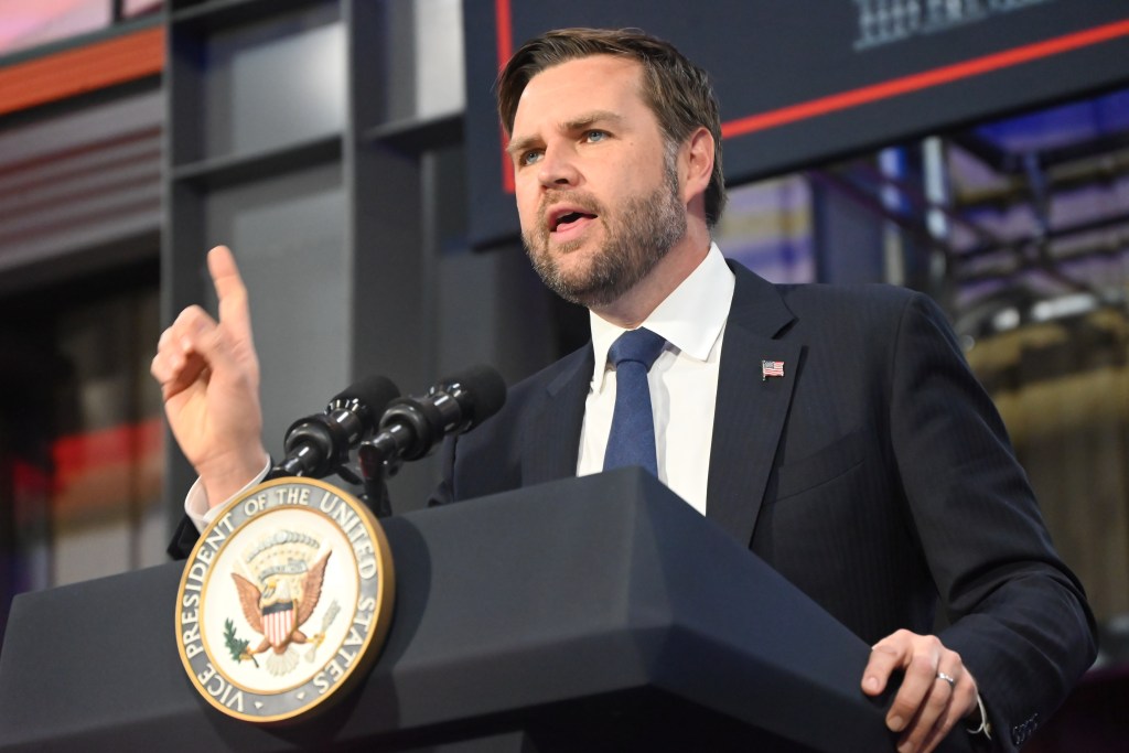 Vice President JD Vance speaking at a podium.
