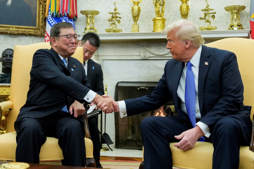 President Donald Trump shaking hands with Japan's Prime Minister Shigeru Ishiba at the White House.