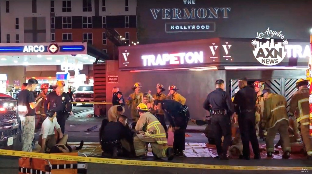 First responders check on injured patrons outside the Vermont Hollywood after the crash.