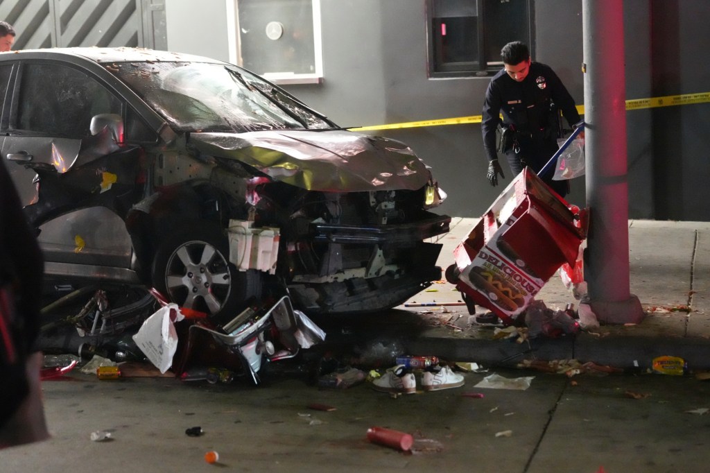 Officials search the scene where Ramirez's car crashed outside the nightclub.
