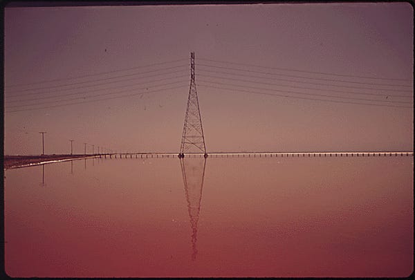 In San Francisco, LESLIE SALT PONDS AT SUNSET. "WATER STINKS," WRITES THE PHOTOGRAPHER ABOUT THIS SCENE
