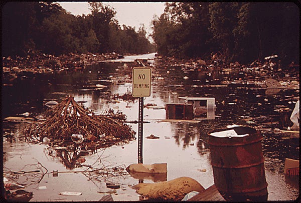 New Orleans, LAKE PONTCHARTRAIN SPILLS OVER ONTO ILLEGAL DUMPING GROUND THE LAKE IS OVER FULL FROM HEAVY RAINS AND WATER DIVERTED FROM THE FLOODING MISSISSIPPI RIVER BY THE OPENING OF THE BONNET CARRE SPILLWAY