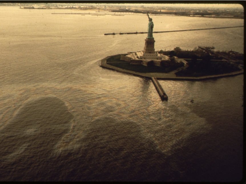 An oil slick surrounding the Statue of Liberty