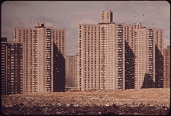 APARTMENTS OF "CO-OP CITY," A VAST HOUSING DEVELOPMENT IN THE BRONX, NOT FAR FROM PELHAM. THESE BUILDINGS STAND ON THE EDGE OF A LANDFILL DUMP, WHERE GARBAGE CONTINUES TO PILE UP ALTHOUGH THE AREA HAS ALREADY EXCEEDED ITS DUMPING CAPACITY