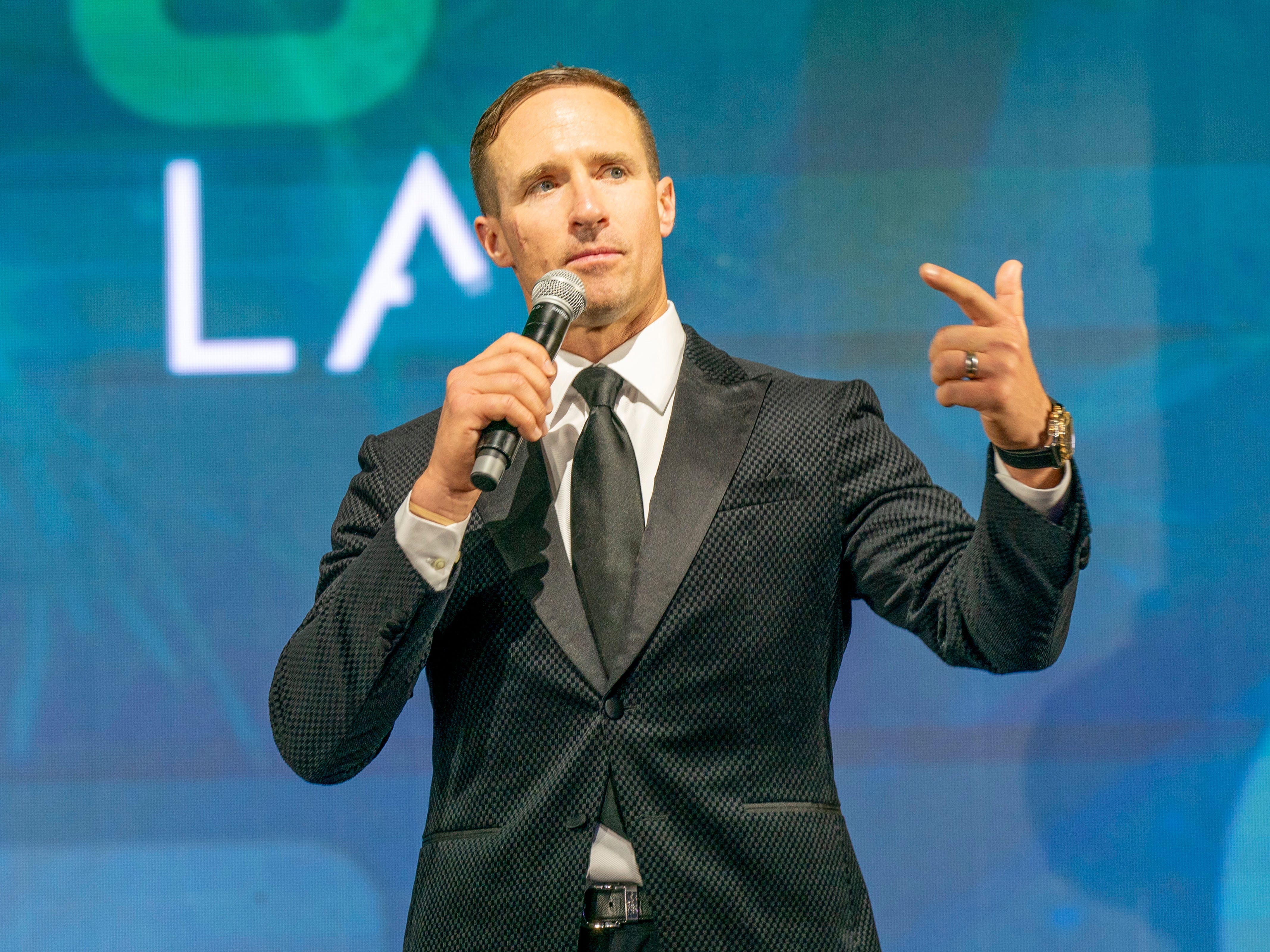 Drew Brees speaking onstage at the 2025 Game Changer Gala.