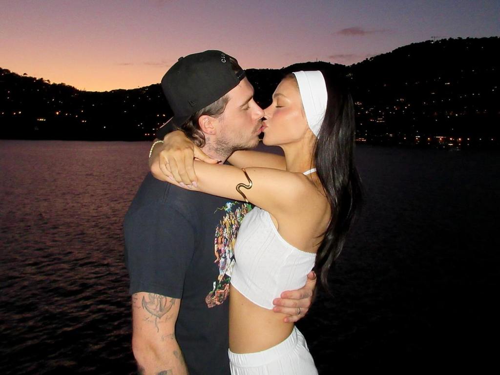 Brookyln Beckham and Nicola Peltz share a smooch while on vacation.