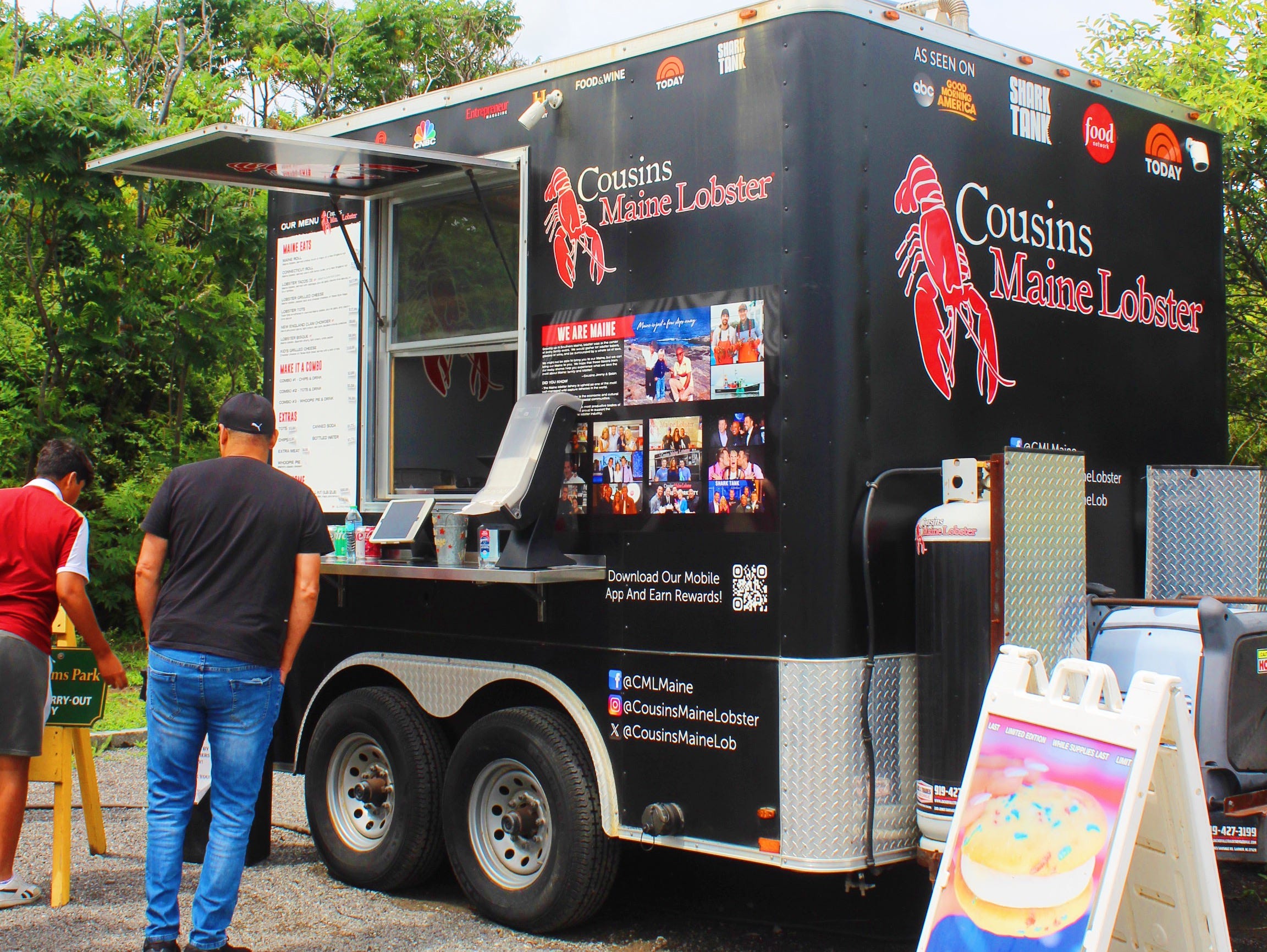 Customers ordering at the Cousins Maine Lobster food truck in Cape Elizabeth, Maine