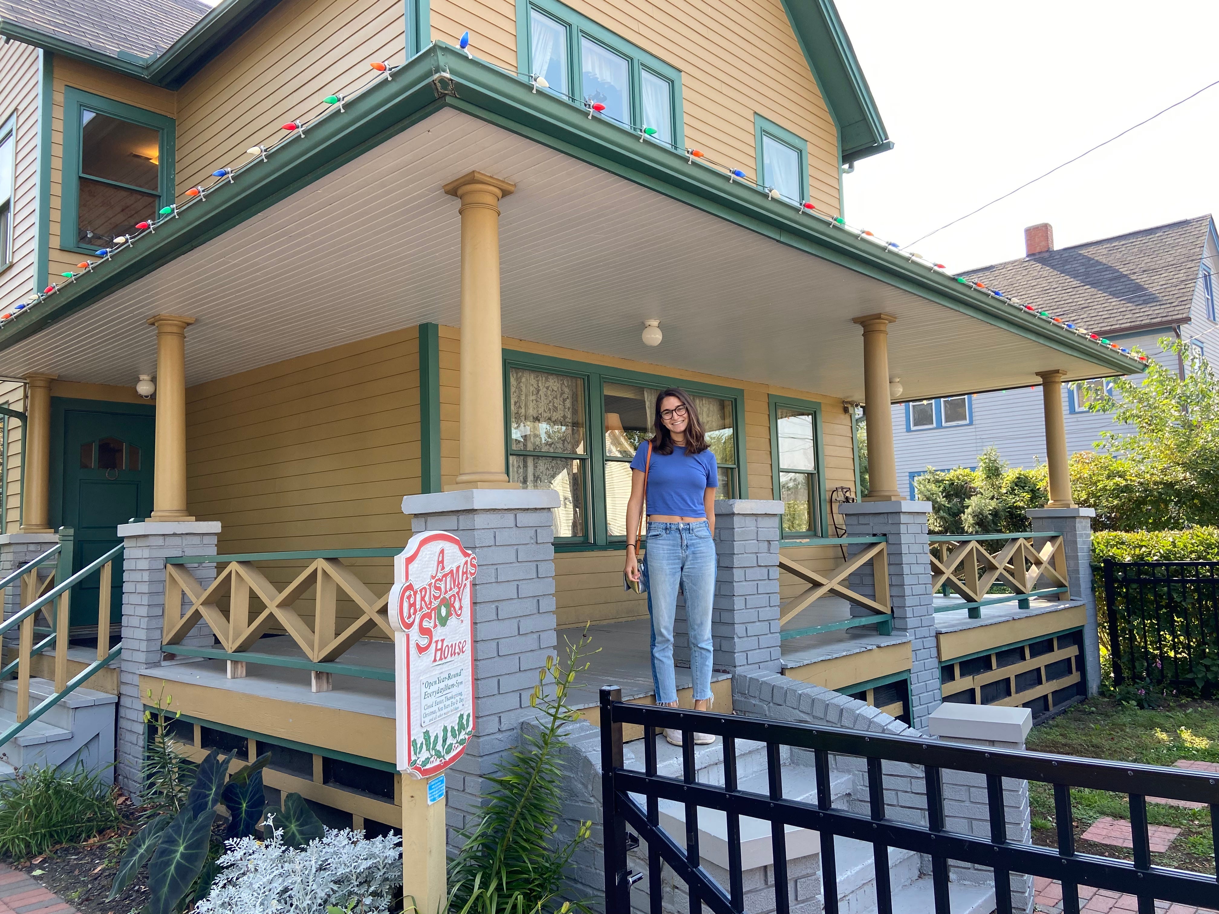 Anna stands on the porch of the house featured in "A Christmas Story."