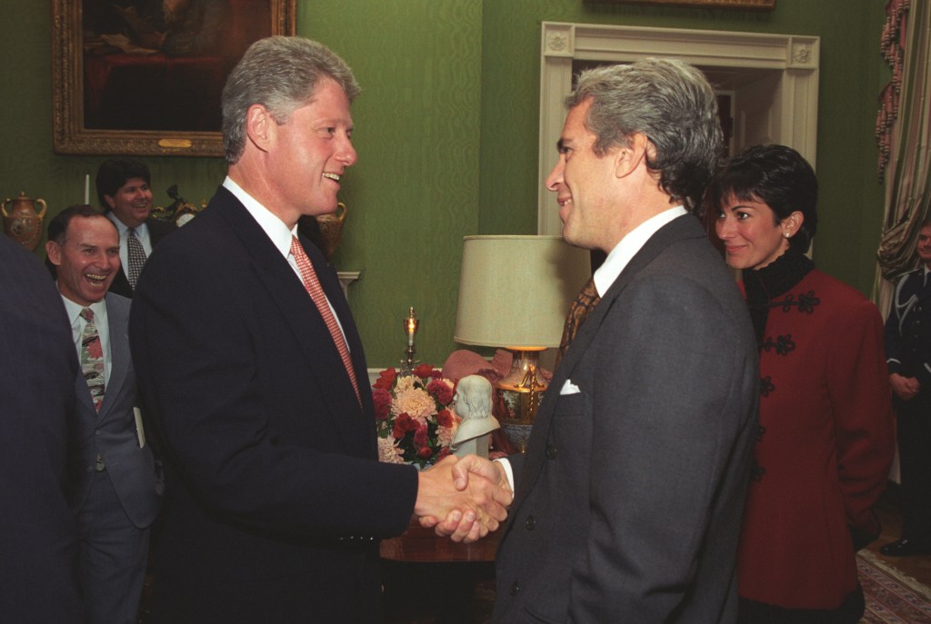 President Bill Clinton shaking hands with Jeffrey Epstein at the White House. Ghislaine Maxwell is visible in the background.