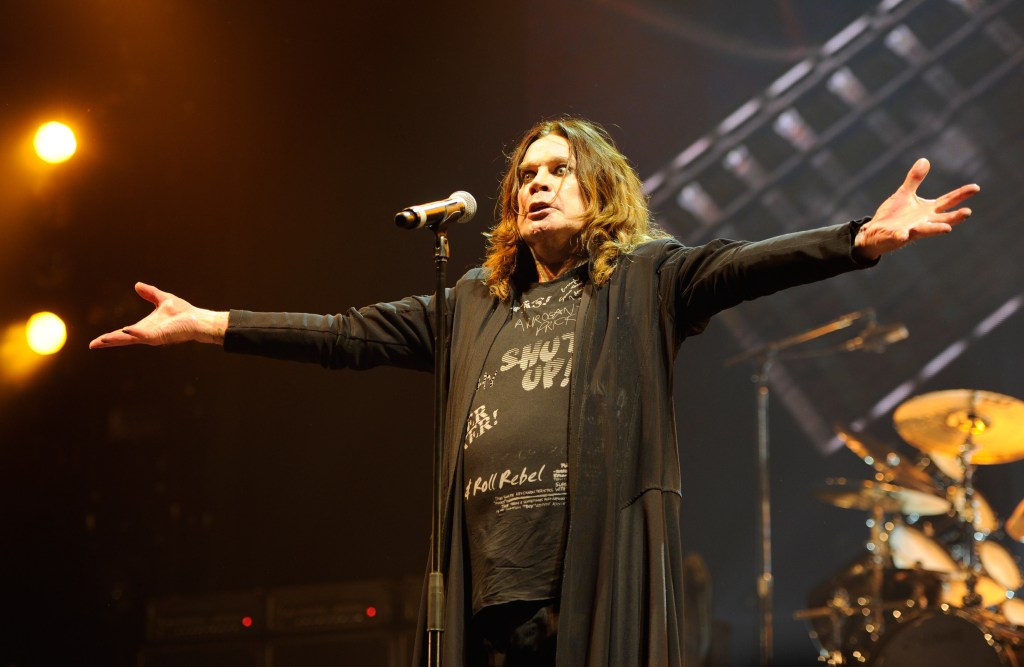Ozzy Osbourne performing on stage.