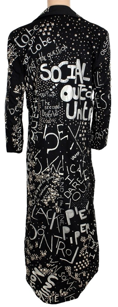 Black studded jacket with silver text and embellishments.