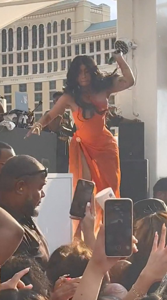 Cardi B throws a microphone at an audience member who hurled a drink at her.