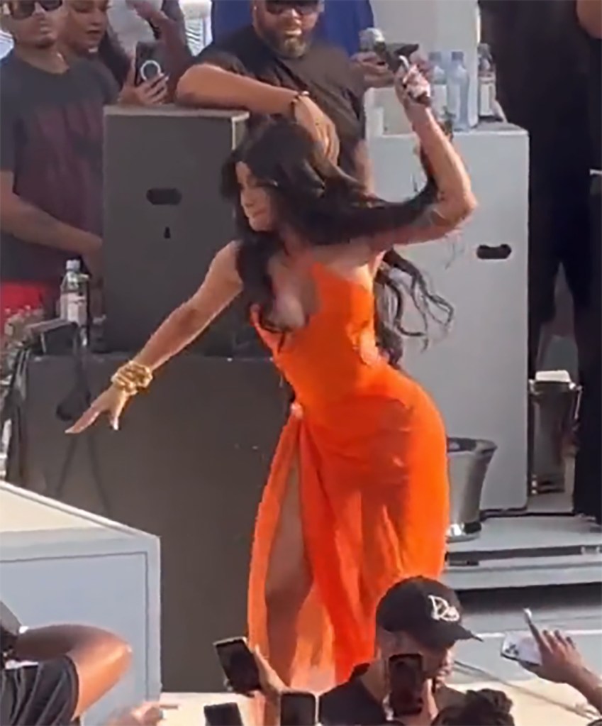 Cardi B throws a microphone at an audience member.