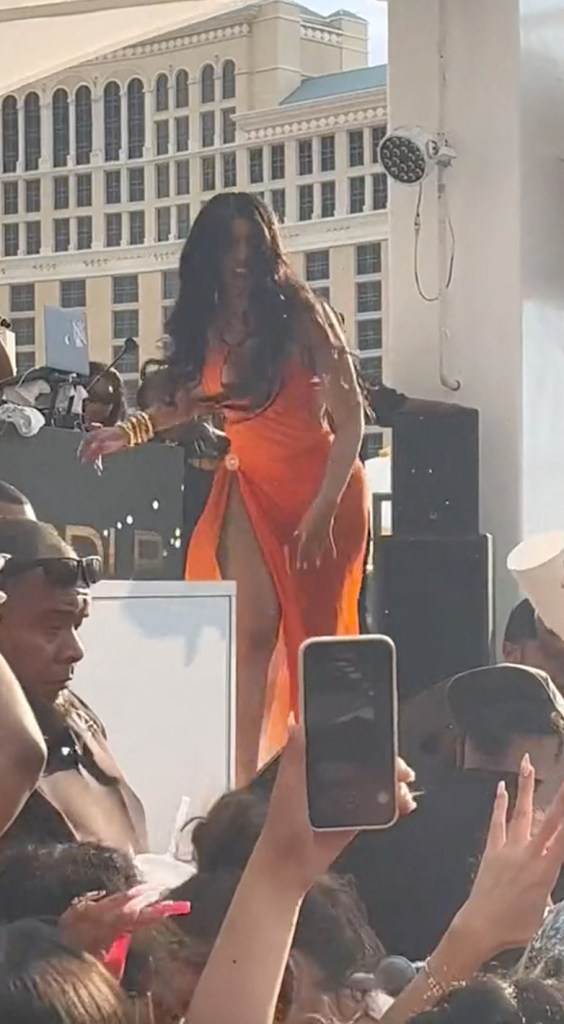 Cardi B throws a microphone at an audience member who hurled a drink at her.