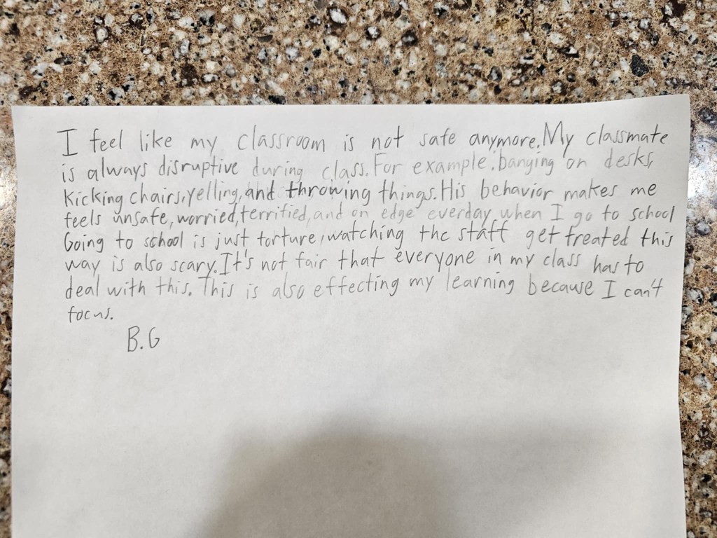 Handwritten note from a third grader describing a classmate's disruptive behavior and its impact on their learning and safety.