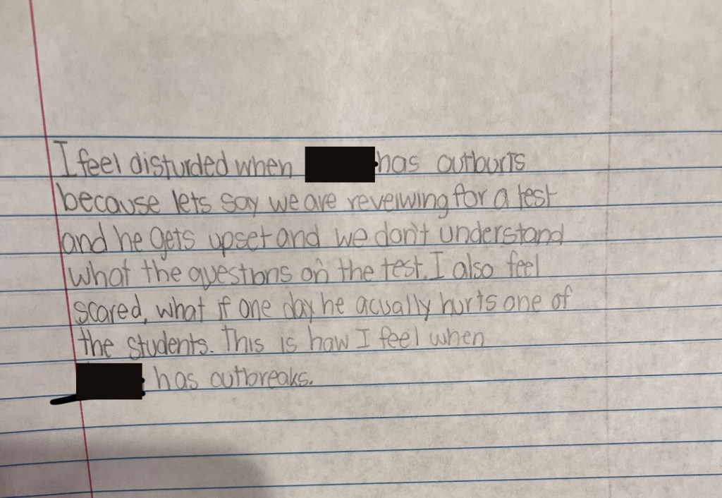 Handwritten note expressing a student's fear of a classmate's outbursts.