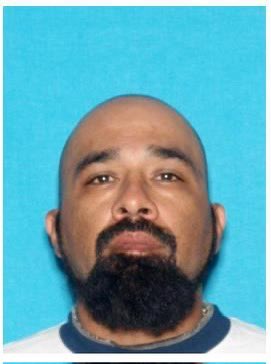Mugshot of Elpidio Reyna, wanted for assault on a federal officer.