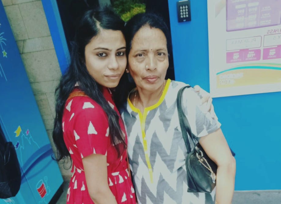 The writer and her mother on an international trip in Singapore.