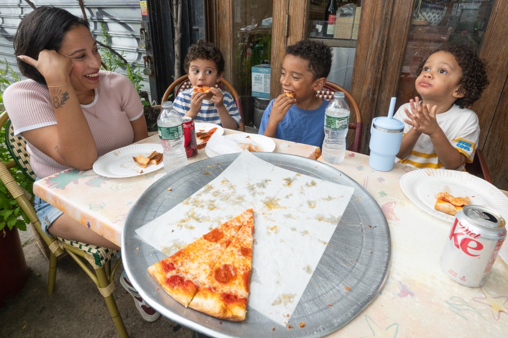 Rosdaly Ramirez, her husband Ruben and their kids at a restaurant. 