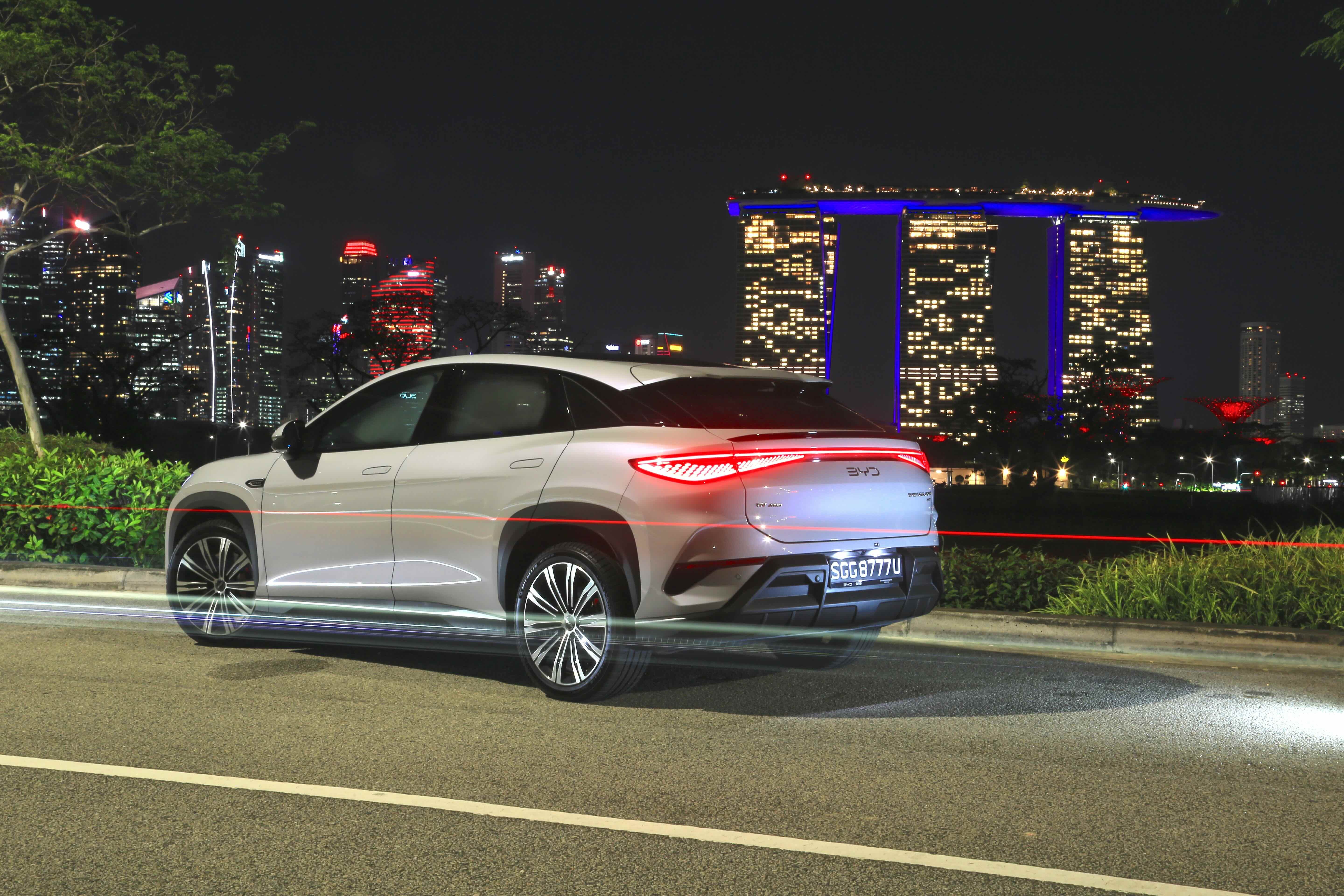 BYD Sealion 7 driving with Marina Bay Sands in Singapore in the background.