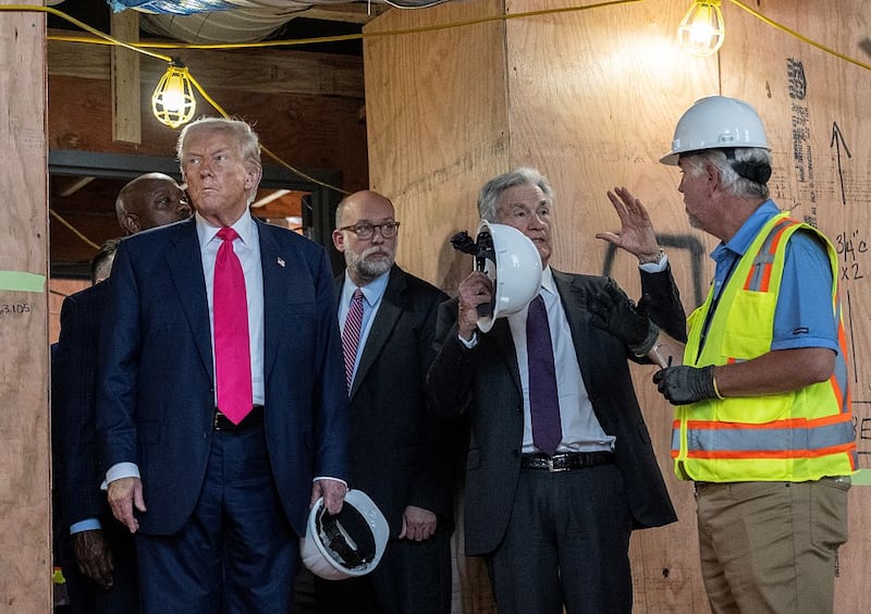 US President Donald Trump and Office of Management and Budget (OMB) Director Russell Vought (C) look on as Federal Reserve Chair Jerome Powell (2nd R) speaks with the construction manager as they tour the ongoing construction at the Federal Reserve in Washington, DC, on July 24, 2025. Trump arrived for a tour of the US Federal Reserve as the president escalates pressure on its chairman Jerome Powell over the central bank's management of the economy. Trump -- who wants to oust Powell for refusing to lower interest rates but likely lacks the legal authority -- has threatened to fire the Fed chief over cost overruns for a renovation of its Washington headquarters. (Photo by ANDREW CABALLERO-REYNOLDS / AFP) (Photo by ANDREW CABALLERO-REYNOLDS/AFP via Getty Images)