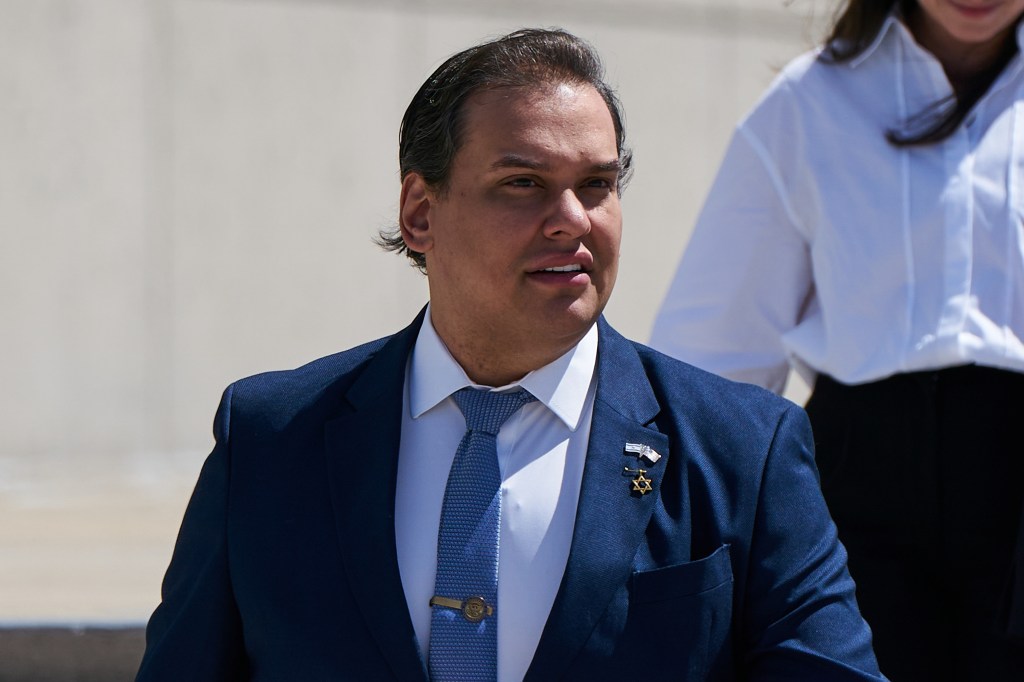 Former Rep. George Santos leaves federal court on Aug. 13, 2024.