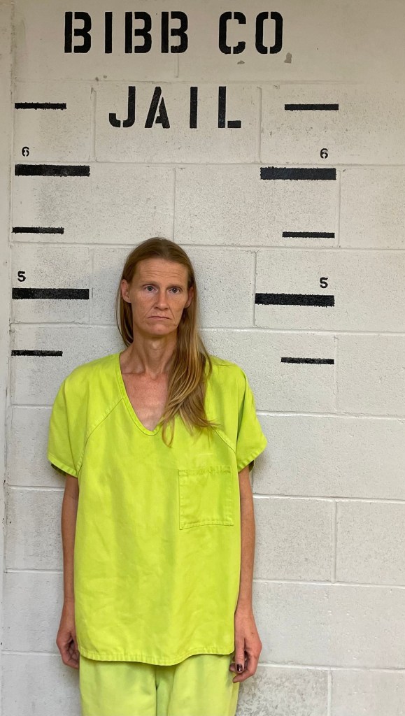 Mugshot of Sarah Terrell in a lime green jumpsuit.