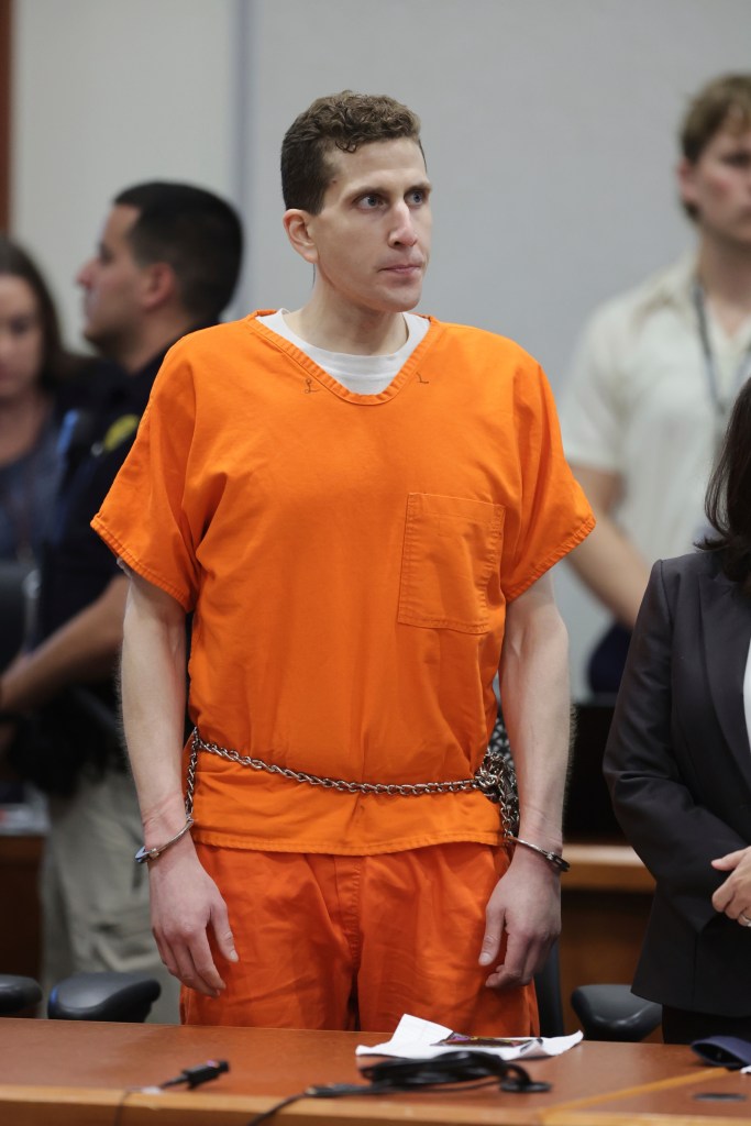 Bryan Kohberger in an orange jumpsuit and handcuffs at a sentencing hearing.