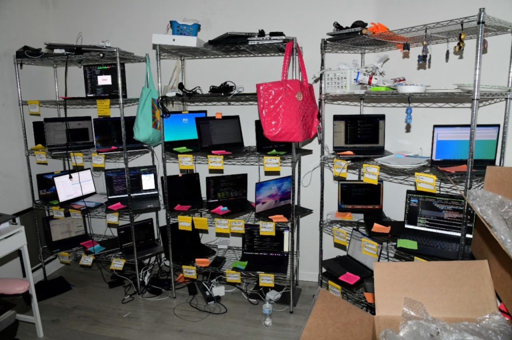 Laptops set up on racks inside Chapman's home.