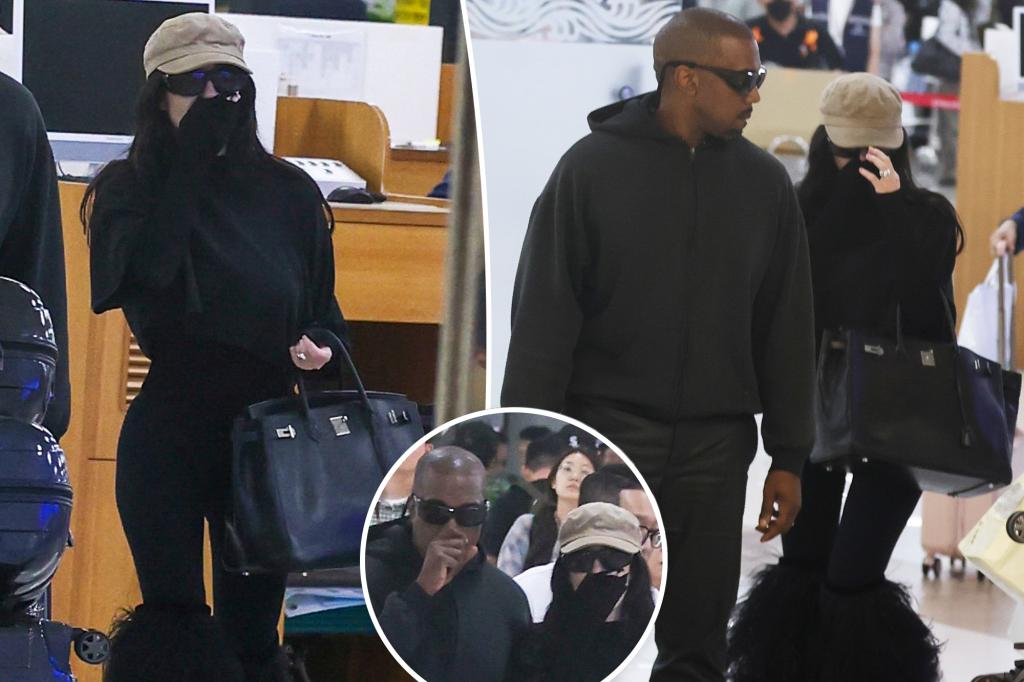 Bianca Censori covers up from head to toe — and totes a Birkin bag — at the airport with Kanye West