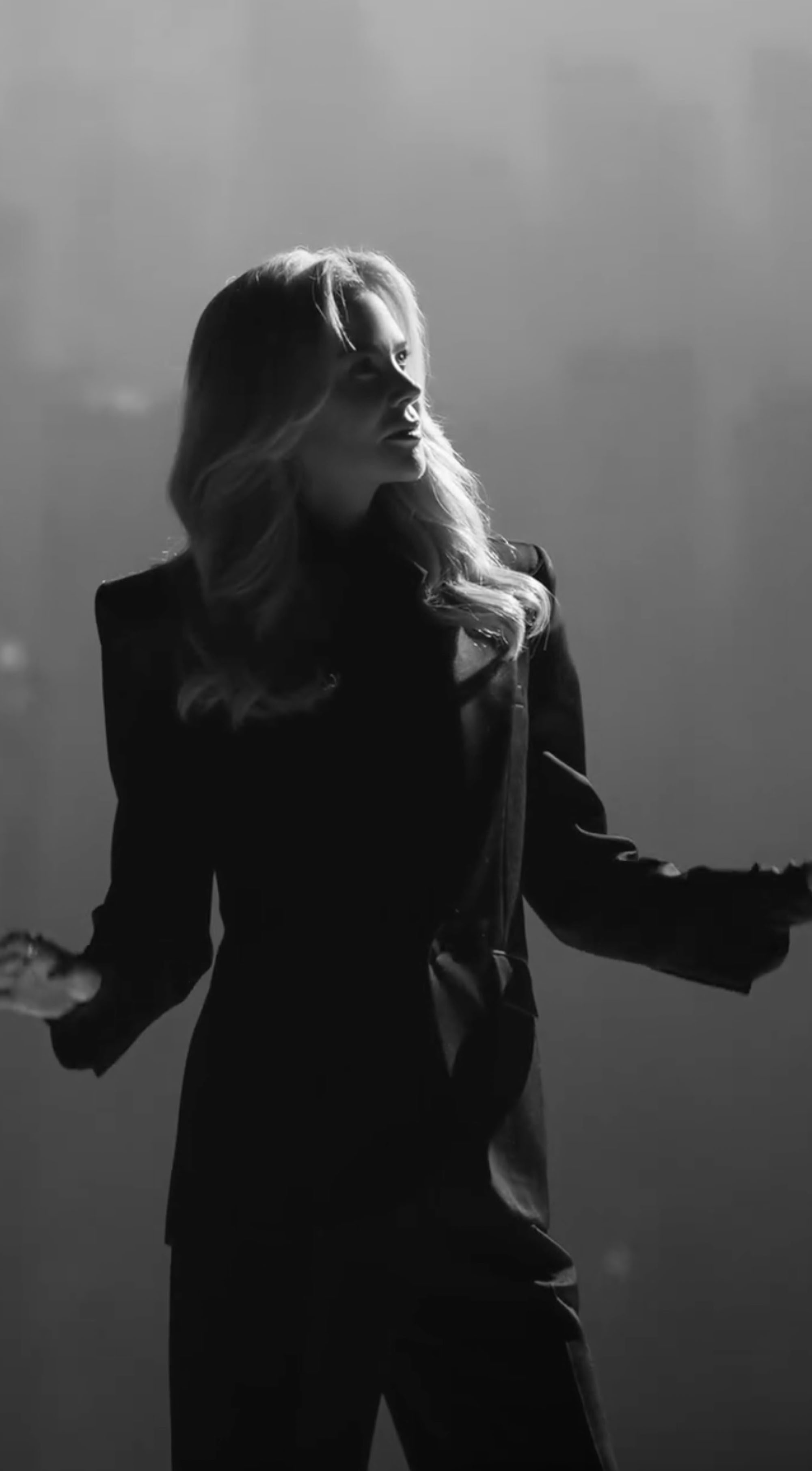 Nicole Kidman in a silk black suit. 