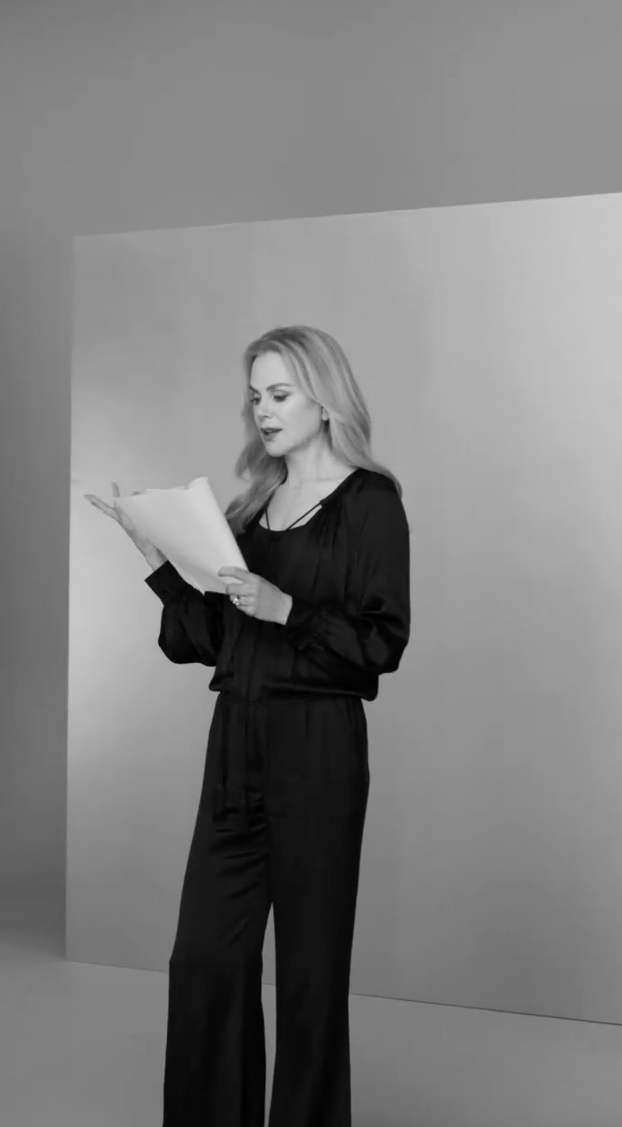 Nicole Kidman reads from a script. 