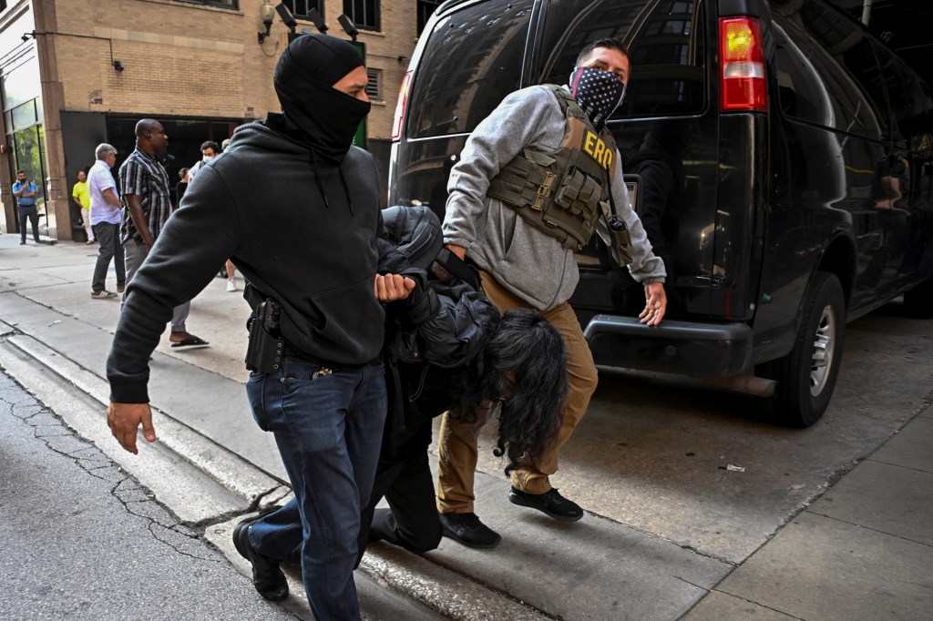 Federal agents detain a protester attempting to block US ICE agents from entering a building housing an immigration court in Chicago, Ill. on June 16, 2025.