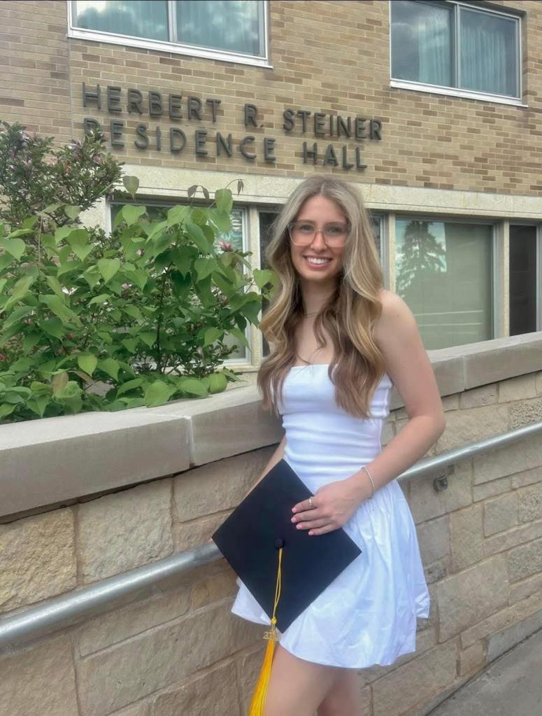 Photo of Eliotte Heinz, a missing 22-year-old graduate student, in front of Herbert R. Steiner Residence Hall.
