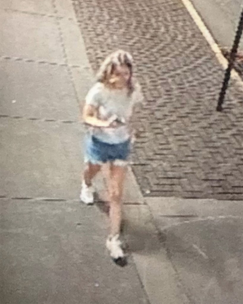 Surveillance image of Eliotte Heinz walking on a city sidewalk.
