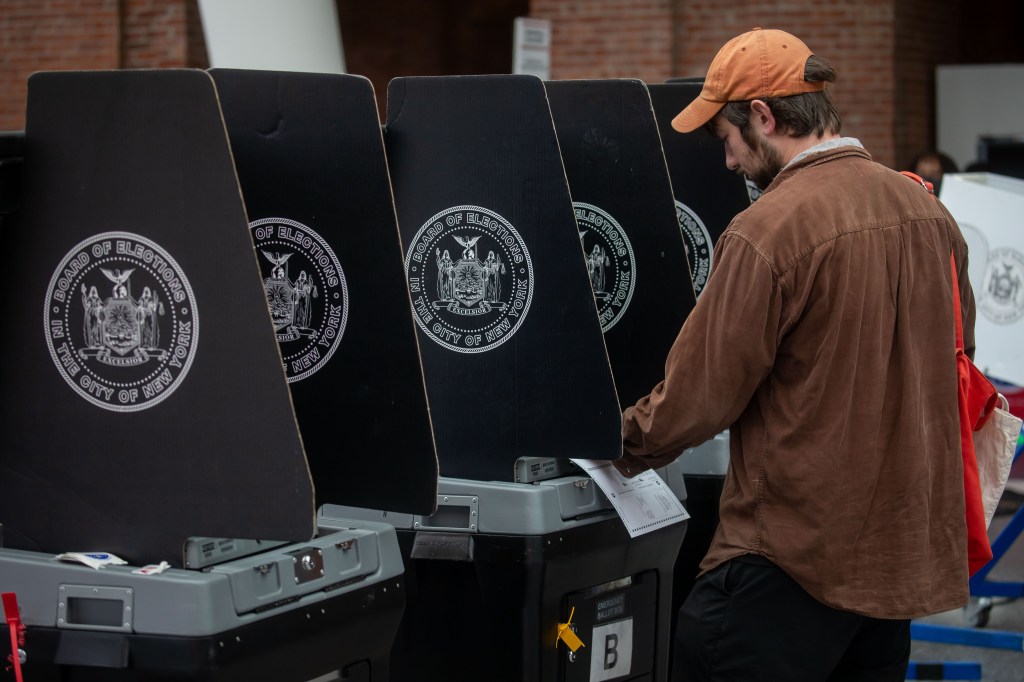 Person using a voting machine.