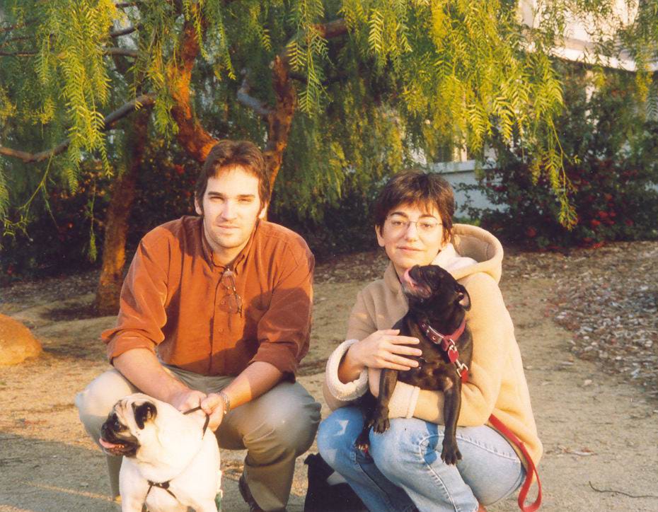 The couple with two dogs at the park in 2003.