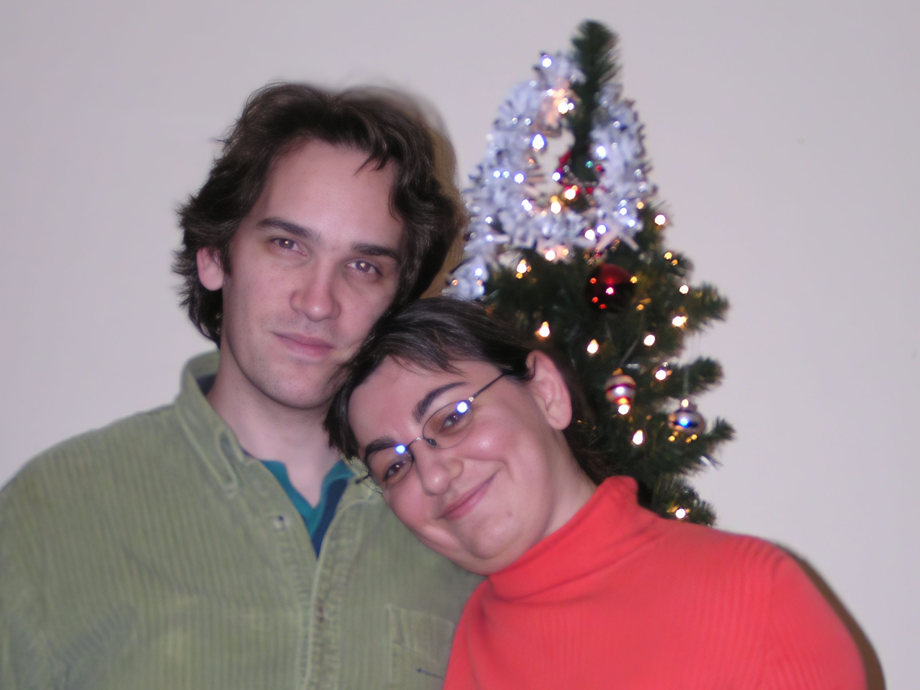 The couple in front of a Christmas tree during the holidays in 2003.