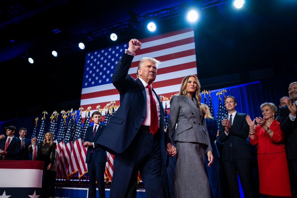 Donald and Melania Trump on stage after an election night watch party.