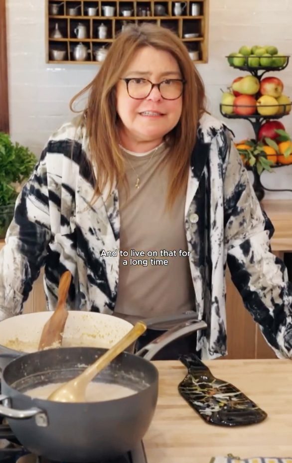 Rachael Ray cooking in her kitchen.