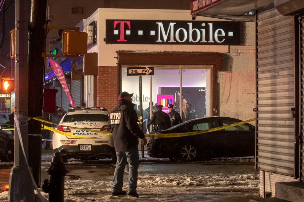 Police investigating a shooting outside a T-Mobile store.