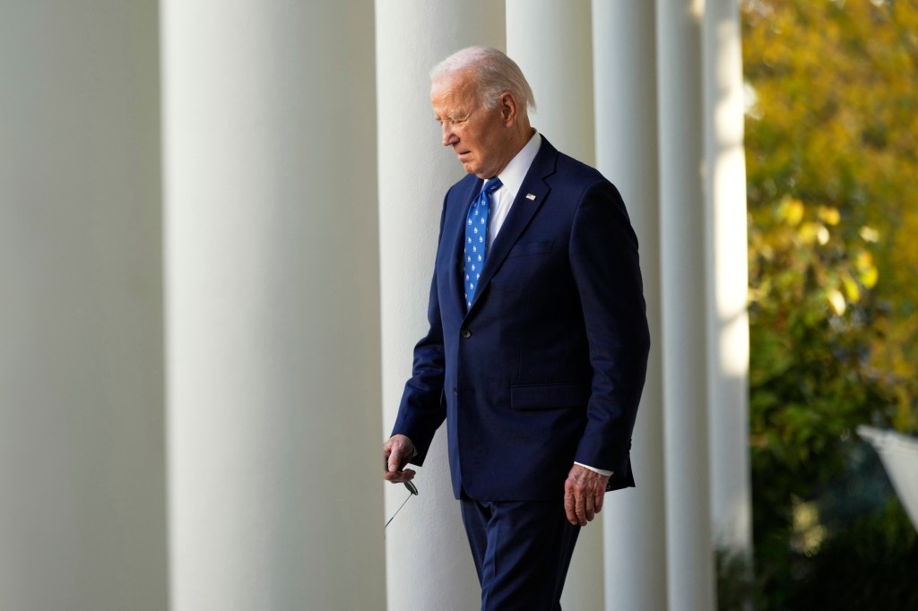 President Biden walking in the White House Rose Garden.