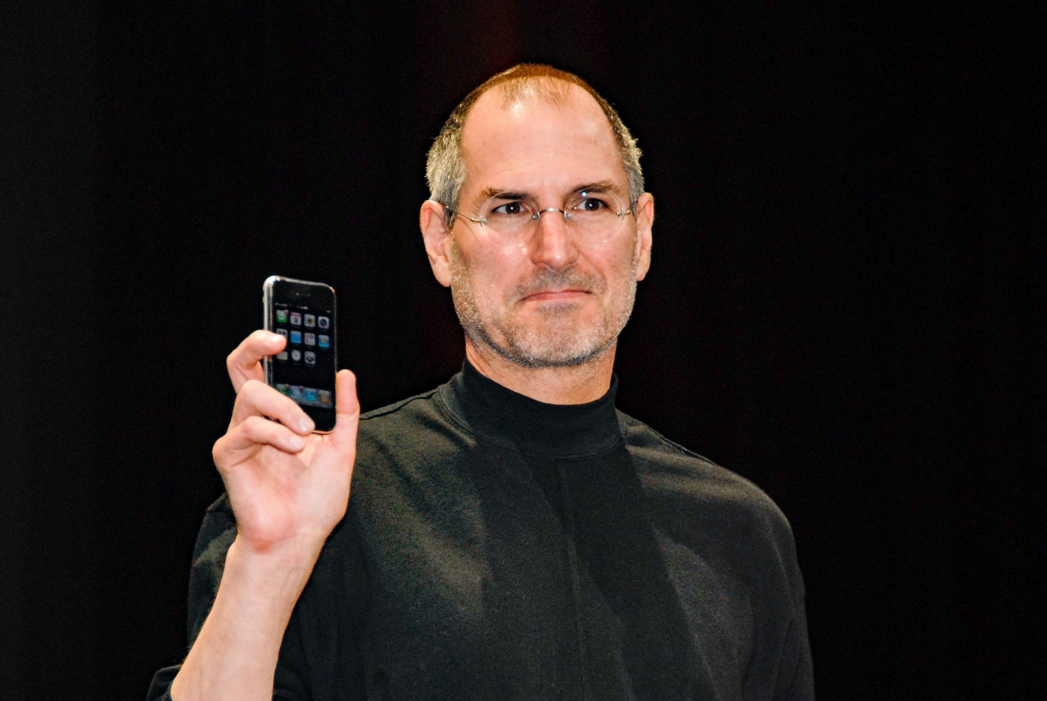 Steve Jobs with an iPhone. 